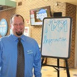 Posing by the MWCA Information sign
